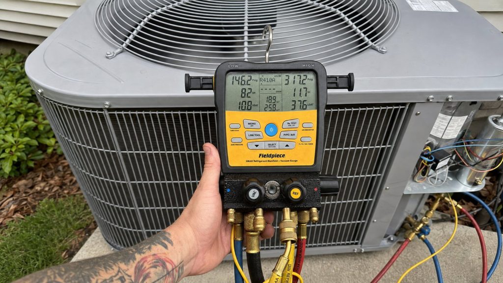 Gesser Services technician measuring with digital gauges